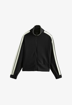 Schwarze Zip-Jacke mit weißen Seitenstreifen, hohem Kragen und elastischen Bündchen. Hergestellt aus weichem Material mit einer lockeren Passform und ohne sichtbare Hardware.