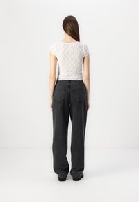 Noisy May NMJANNEL LOOSE - Relaxed fit jeans - black denim