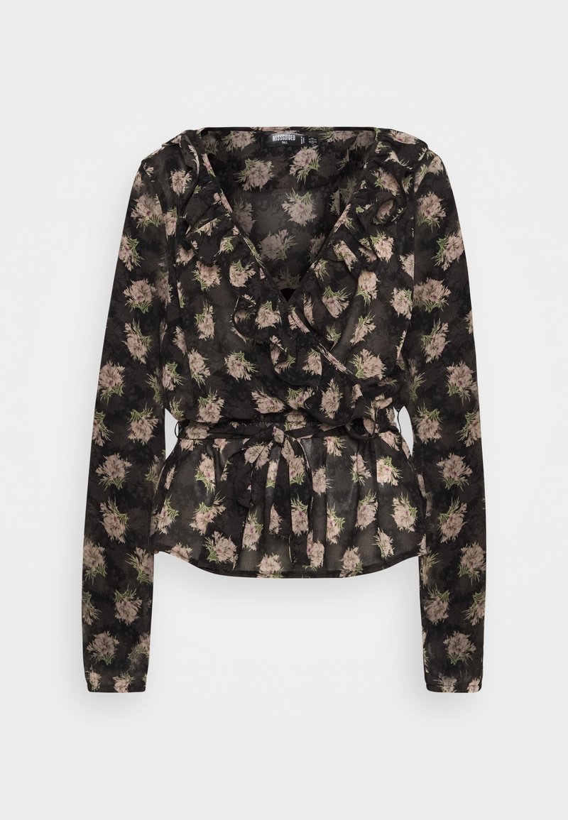 Blouse noire à motif floral avec manches longues, tissu léger et transparent, encolure à volants, taille ceinturée et motif floral rose avec accents verts.