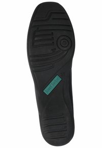 Suela de zapato negra con patrones de agarre texturizados. Presenta una etiqueta rectangular con "Josef Seibel" y la talla "37" incorporada en el material.