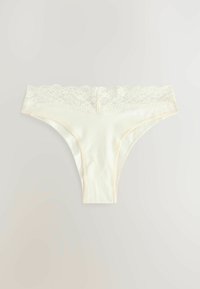 Slips met kant in off-white, voorzien van een soepele katoenen stof, zachte textuur en een minimalistisch ontwerp met subtiele crèmekleurige accenten.