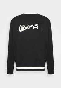 Sweatshirt noir à manches longues avec le texte "AIR" en blanc et le logo swoosh sur la poitrine, et un ourlet rayé blanc.