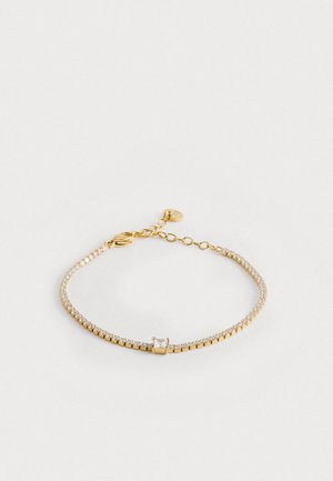 Χρυσόβερες βραχιόλι με μικρούς διαφανείς κρυστάλλους. Ρυθμιζόμενη αλυσίδα με τετράγωνο κέντρο, λεία υφή και λεπτό σχέδιο.