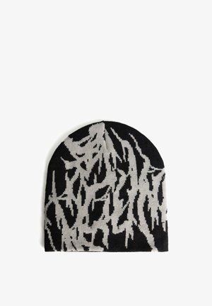 Berretto lavorato a maglia nero con motivo astratto grigio chiaro irregolare che assomiglia a pennellate o graffiti.