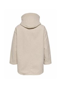 Beežist villasegu mantli, kapuutsi ja pehme tekstuuriga, lai ja kolmeveerandvarrukatega. Õmbluse detail jookseb vertikaalselt selja peal.