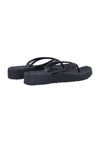 Chanclas negras con suelas tejidas texturizadas y correas suaves, que presentan un diseño minimalista y una construcción ligera.