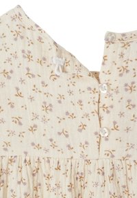Helles beiges Kleid mit floralem Muster in zartem Lila und Braun, mit gefaltetem Design und Knopfverschluß am Hals.