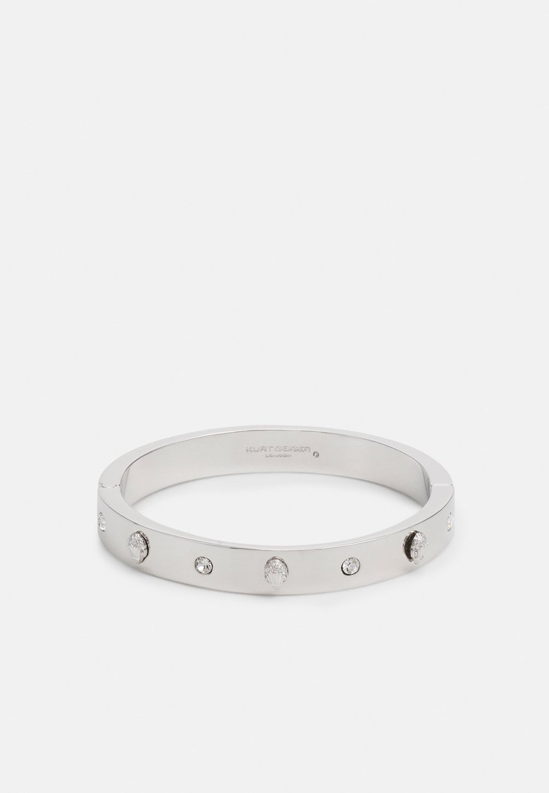 Bracciale rigido in tono argento con cinque cristalli trasparenti incastonati in una fascia liscia e moderna, dal design minimalista e finitura lucida.