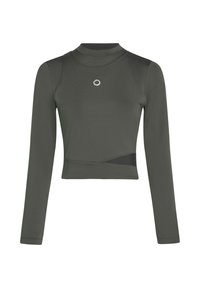 Hosszú ujjú, testhez álló croptop sötétzöld anyagból. Magas nyakkal, sima fazonnal rendelkezik, és elöl egy ezüst kör alakú emblémával díszített.