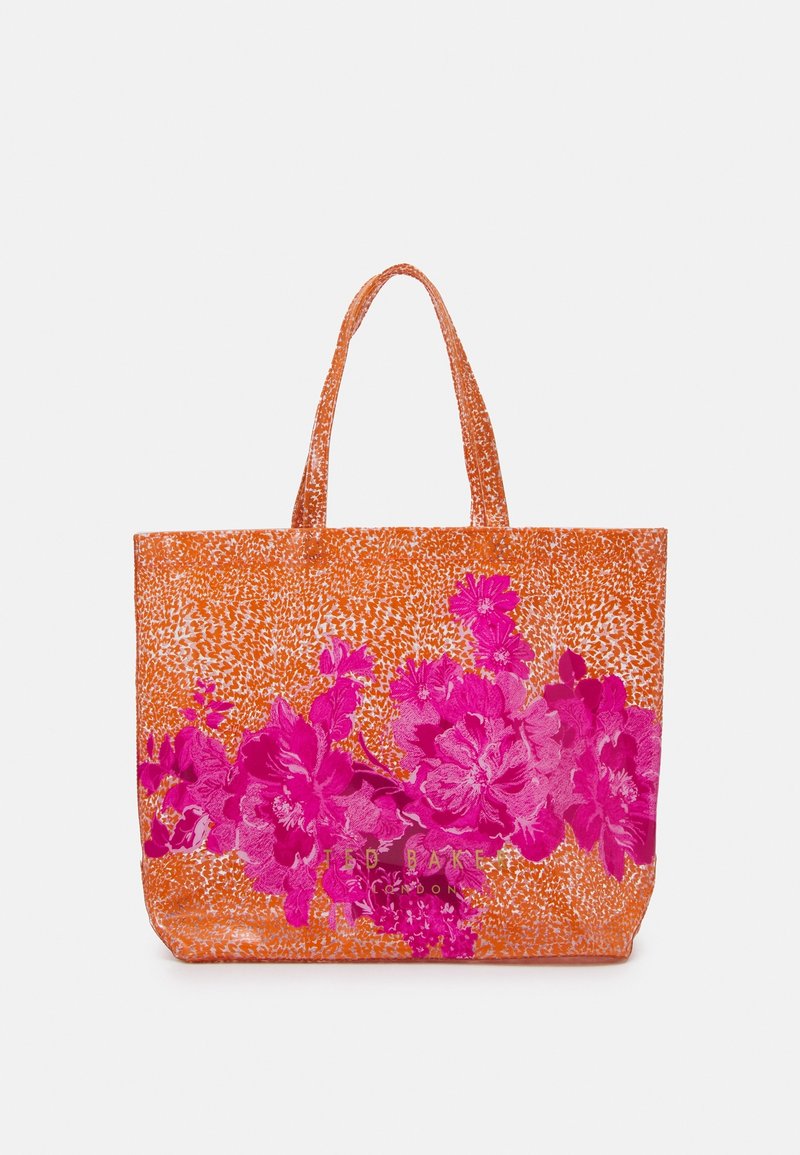 Grand sac fourre-tout en tissu orange texturé, avec des motifs floraux roses vifs et deux poignées solides.