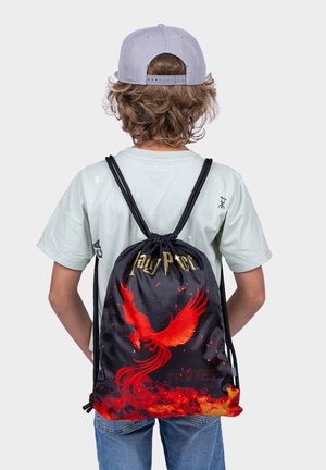 Black drawstring backpack featuring a red phoenix graphic and "Harry Potter" text, made of durable fabric with textured design.