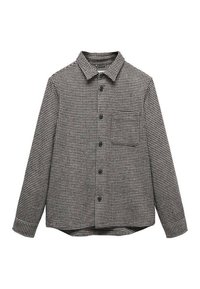 Camisa de cuadros en blanco y negro con cierre de botones en el frente, mangas largas, cuello y un bolsillo en el pecho. Hecha de tela texturizada.