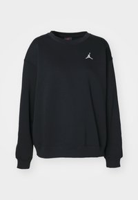 Sudadera negra de mezcla de algodón, con un cuello redondo, mangas largas y un pequeño logo blanco en la parte superior izquierda del pecho.