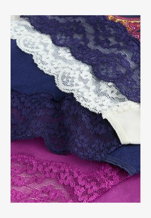 Lace trim in white, navy, and purple across fabric layers. Intricate floral patterns on lace, contrasting with solid colors, smooth texture.