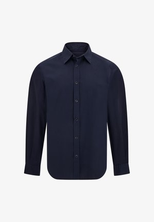 Camicia a maniche lunghe di colore blu navy, realizzata in tessuto liscio, con colletto a punta, bottoni sul davanti e orlo arrotondato. Senza fantasie né dettagli.
