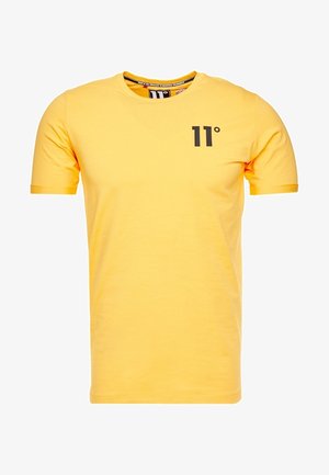 T-shirt en coton jaune à manches courtes. Présente un logo noir "11°" sur le devant, un col rond et une coupe confortable.
