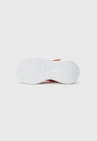 White athletic shoe sole with textured patterns, featuring orange and blue accents and a durable rubber construction.