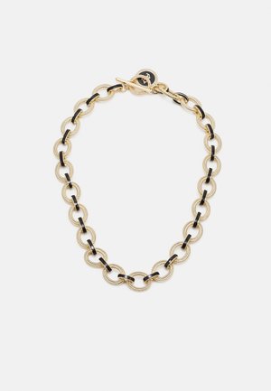 Collier chaîne en or avec des maillons ovales noirs alternant textures et lisses, sécurisé par un fermoir toggle.