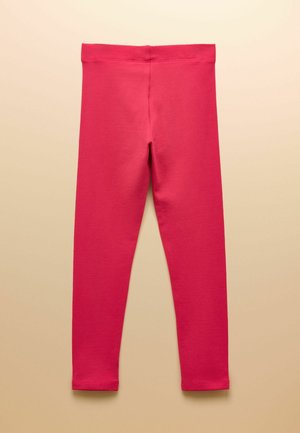 Helle pinke, knöchellange Leggings mit elastischem Bund, flach auf einem hellbeigen Hintergrund liegend dargestellt.