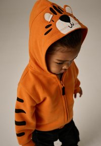 Next CHARACTER  - REGULAR FIT - Mikina so zipsom - orange tiger