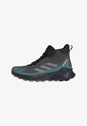 Grey and teal hiking shoes with a textured upper, black accents, lace-up closure, and a rugged sole designed for outdoor traction.