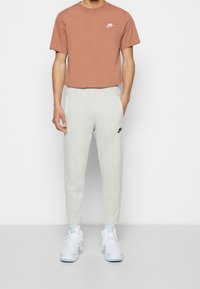 Nike Sportswear Träningsbyxor - silver-coloured