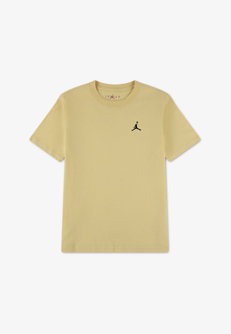 T-shirt beige à manches courtes et col rond avec logo Jumpman noir sur la poitrine gauche, design minimaliste, vue à plat sur fond blanc.
