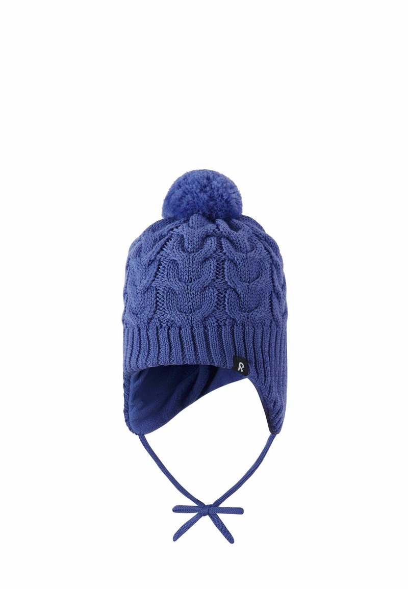 Knitted blue winter hat with a textured cable pattern, a pom-pom on top, ear flaps, and a tie under the chin for secure fit.
