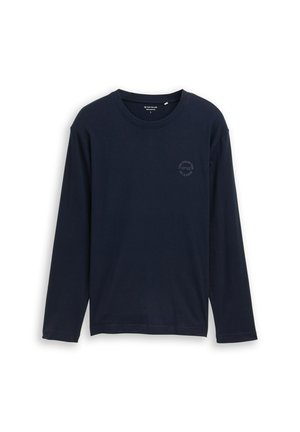 Marineblauwe lange mouwen t-shirt van katoen. Heeft een ronde halslijn en een klein logo gedrukt op de linkerkant van de borst. Soepele textuur.