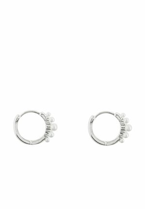 Silver hoop earrings each adorned with four small white pearls arranged in a row on one side.