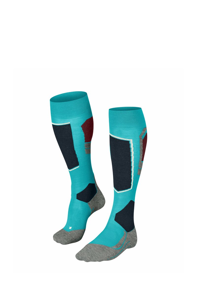Skarpety do kolan w kolorze turkusowym, z czarnymi i bordowymi akcentami, szarym piętą i palcem. Teksturowane obszary zapewniają dodatkowe wsparcie.