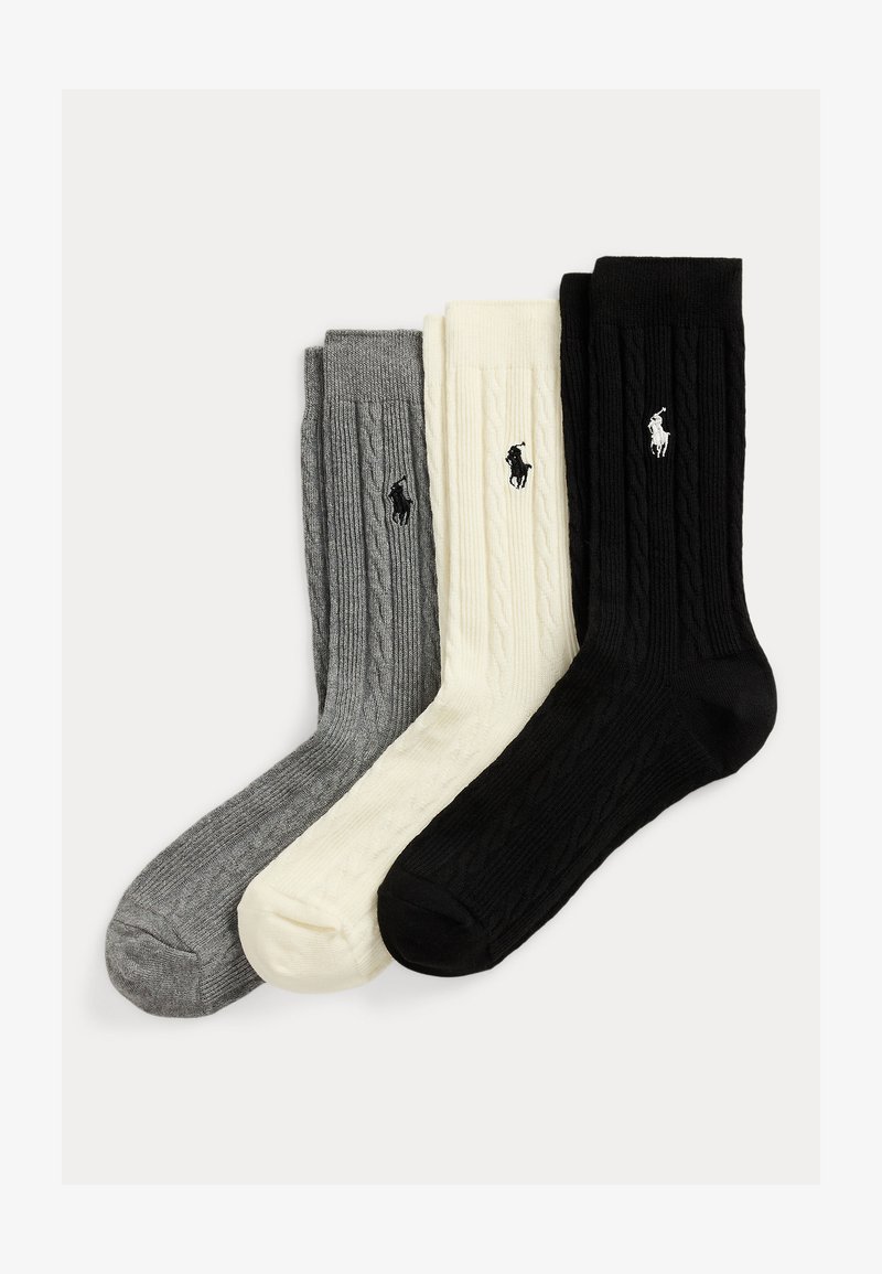 Három pár bordázott kötött zokni szürke, krémszínű és fekete színekben, mindegyiken egy kis hímezett lovaspóló játékos logó található az oldalon.