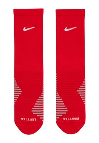 Calze sportive rosse realizzate in tessuto a maglia, con un motivo testurizzato, logo Nike in bianco e le diciture "SINISTRA" e "DESTRA" sulle suole.