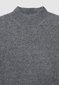Gray knitted sweater with a textured pattern, featuring a ribbed crew neckline and soft wool blend material. No visible hardware or accents.