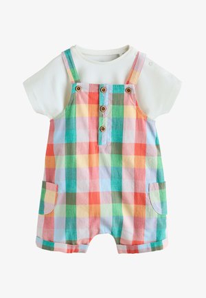 Chemise blanche à manches courtes sous une combinaison ample à carreaux pastel colorée avec boutons sur le devant, bretelles et poches latérales pour tout-petit.