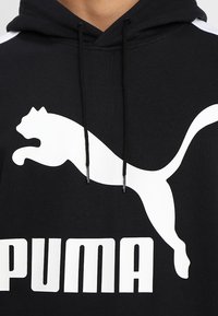 Puma Jersey con capucha - black