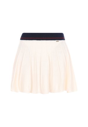 Gebreide rok in crème met een geribde donkerblauwe tailleband met een rode streep; uitlopende stijl met verticale plooien. Metalen accent nabij de zoom.
