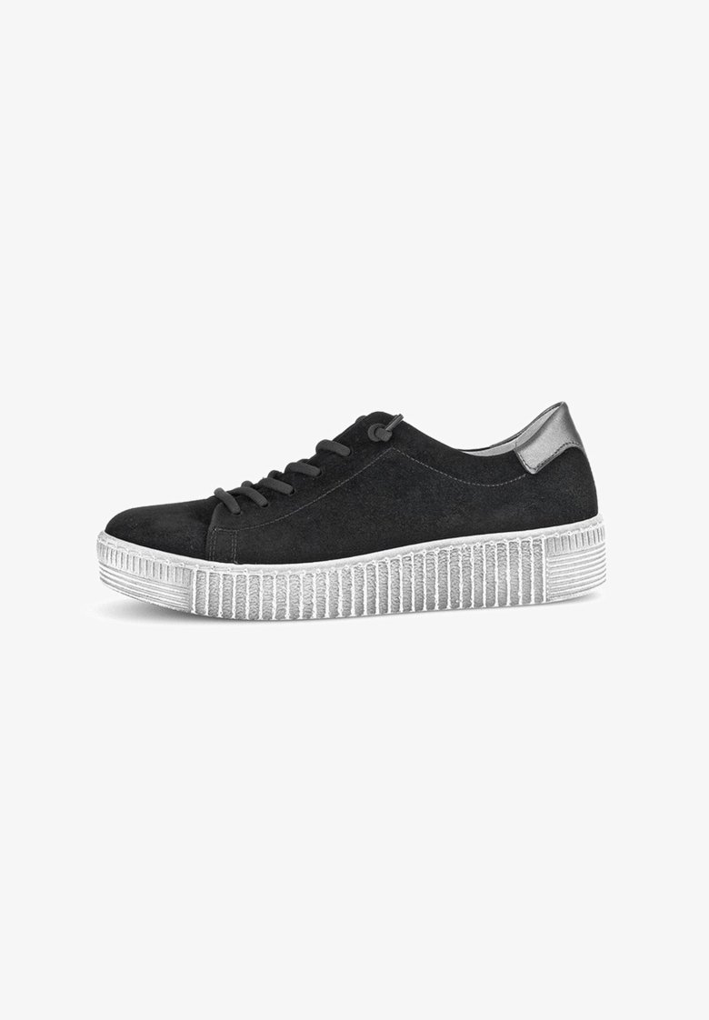 Black suede sneaker with a textured white sole. Features a smooth metallic accent at the heel and classic lace-up design.