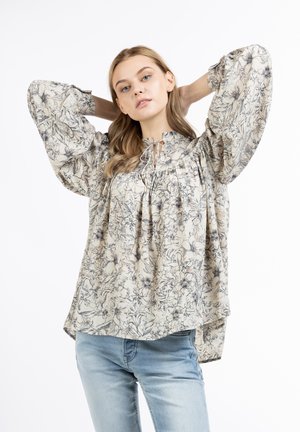 Bluse mit Blumenmuster in Creme mit lockeren Puffärmeln, gerafftem Ausschnitt und Bändern. Leichter Stoff mit einer weichen, strukturierten Oberfläche.