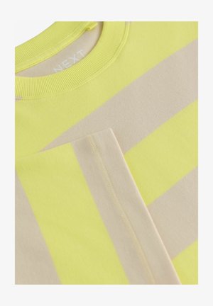 Puuvillane särk, millel on horisontaalsed triibud neoonkollases ja beezis, ribikrae ning kontrastne kollane õmblus.