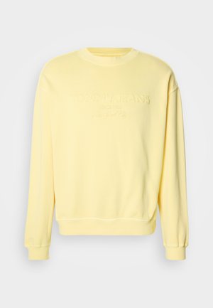 Gele sweater van een katoenmix, met geribde boorden en zoom, met een geperst "Tommy Jeans" logo op de voorkant. Klassiek ontwerp met ronde hals.