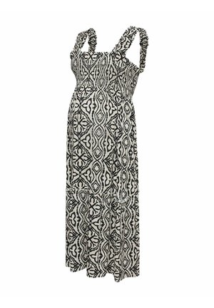 Vestido largo con tirantes anchos con volantes y patrón geométrico en blanco y negro, con falda de varios volantes y corpiño ajustado.