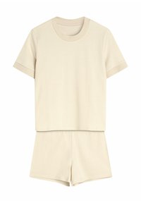 Beżowy zestaw w paski, składający się z krótkiego topu z okrągłym dekoltem oraz pasujących szortów z elastycznym pasem. Miękka faktura tkaniny.