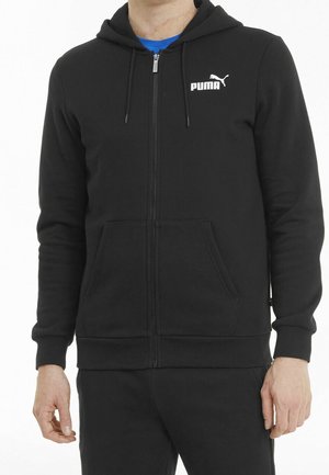 Zwarte hoodie met ritssluiting, kangoeroezakken, geribbelde boorden en zoom. Voorzien van een wit Puma-logo op de borst. Zachte, gestructureerde stof.
