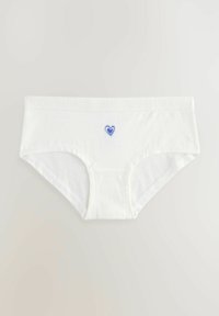 Slip hipster bianco in cotone con un design a cuore blu sulla parte anteriore e un morbido elastico con marchio in vita. Texture liscia.