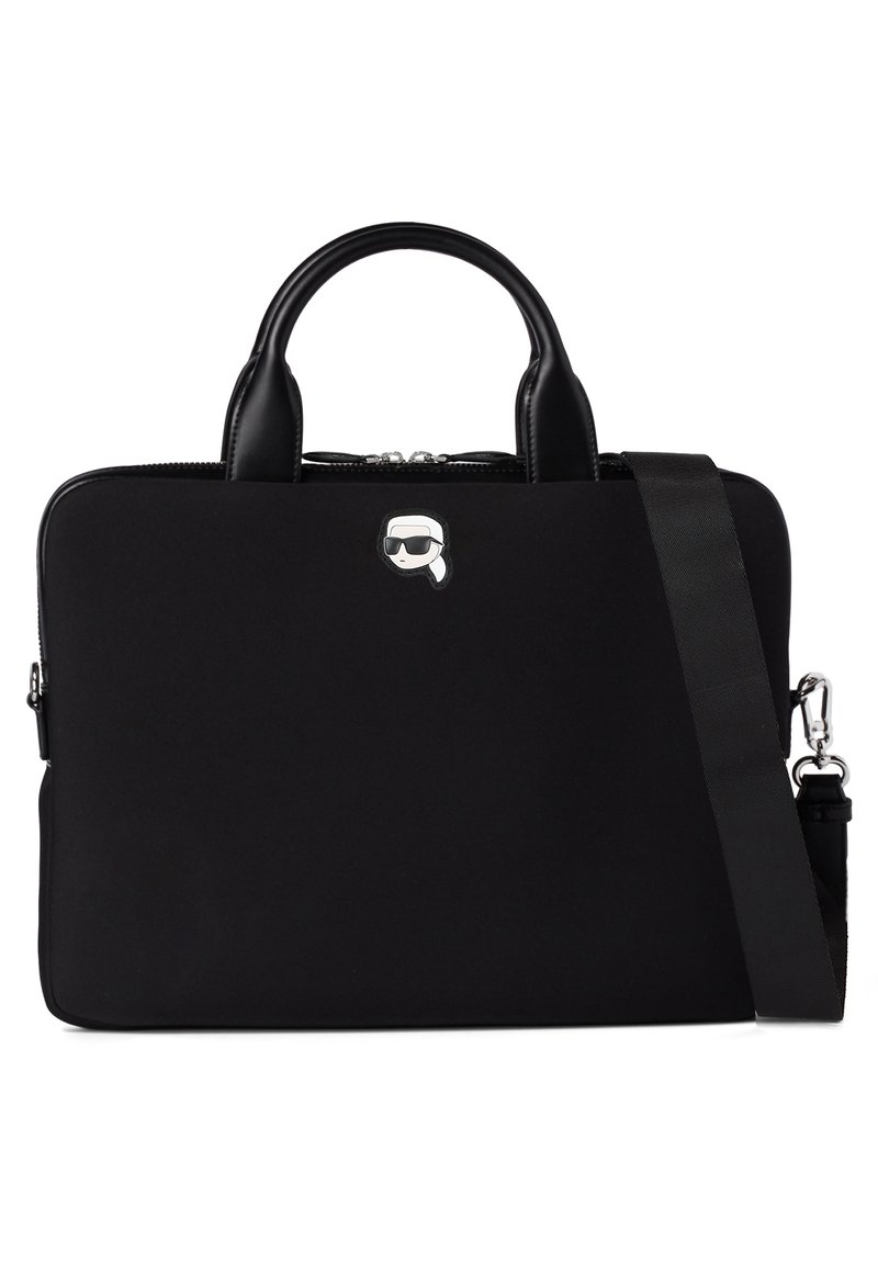 Black laptop bag made of smooth fabric, featuring two top handles, a detachable strap, and a silver cartoon logo on the front.