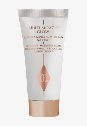 White tube with a rose gold accent at the base. Label reads "Multi-Miracle Glow" and includes product details in English and French.