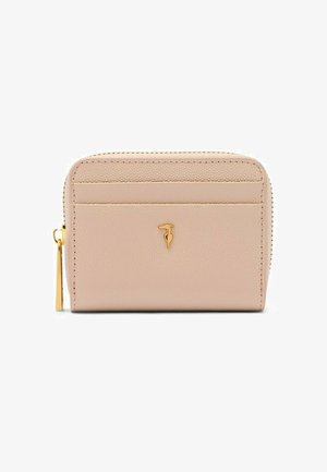 Compact beige leren portemonnee met gouden rits en klein gouden vogelemmbleem in het midden aan de voorkant.