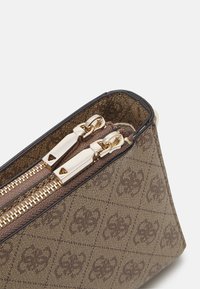 Guess Sac bandoulière - latte logo