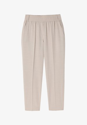 Pantalons beige clair avec une taille élastique, jambes fuselées, poches latérales et une texture lisse. Design simple et minimaliste.